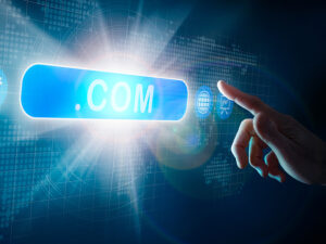 a businessman touching a .com domain extension depicting ready to invest in the digital world