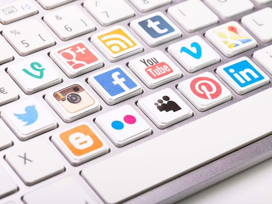 a keyboard with many social media platform logos