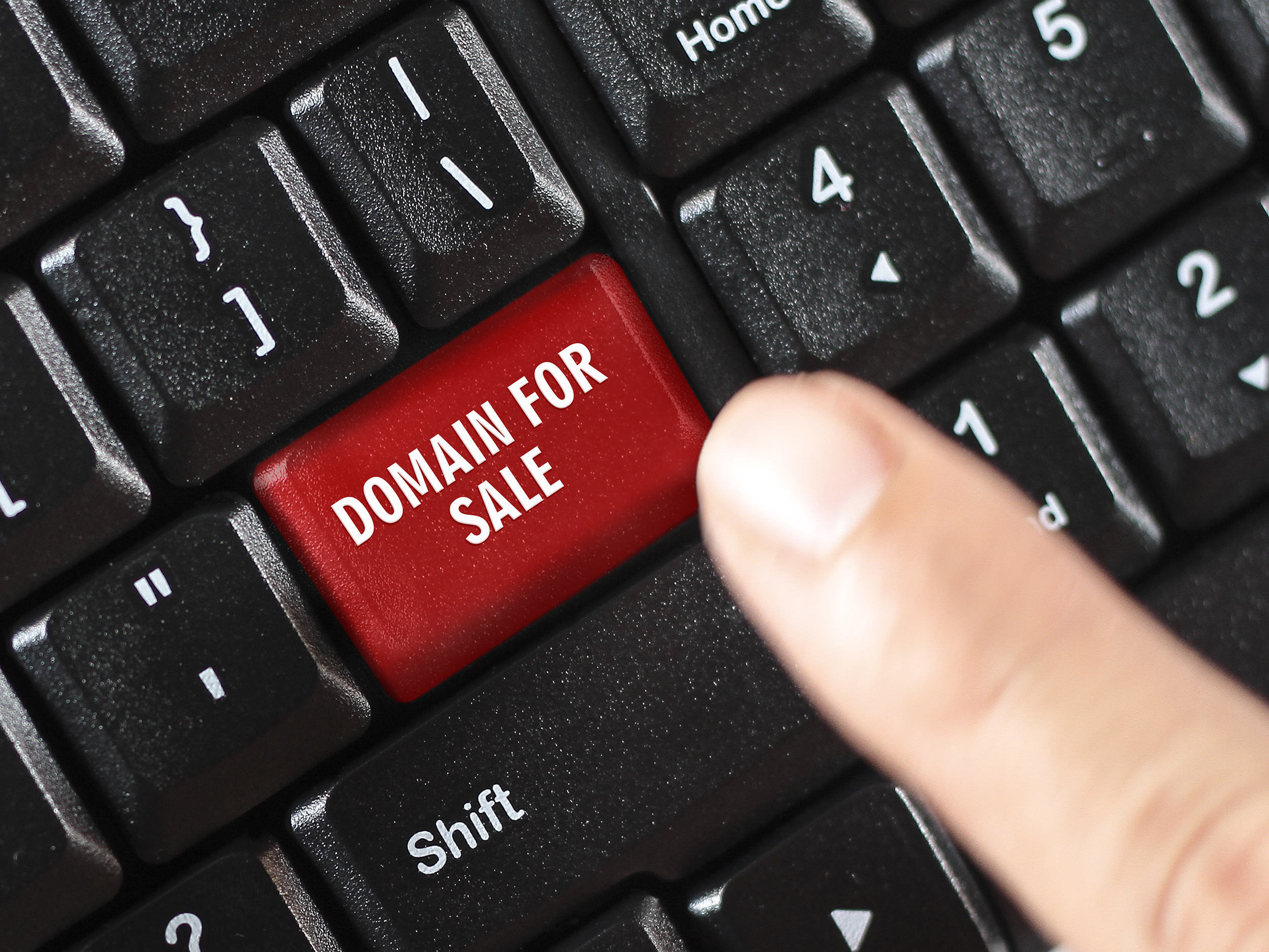 domain for sale words on red keyboard button